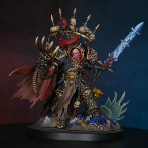 May include: A black and gold painted miniature of a Chaos Space Marine with a red face, a red cape, and a blue energy sword. The miniature is standing on a base with a skull and other details.
