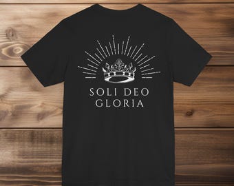 May include: Black t-shirt with a white crown and the text "Soli Deo Gloria" printed on the back.