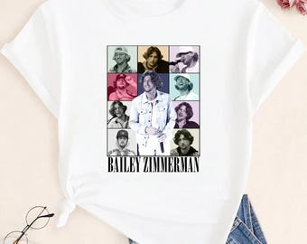 May include: White t-shirt featuring a grid of nine images of Bailey Zimmerman, with the name "BAILEY ZIMMERMAN" printed in black below the images. The images are in a variety of poses and settings.