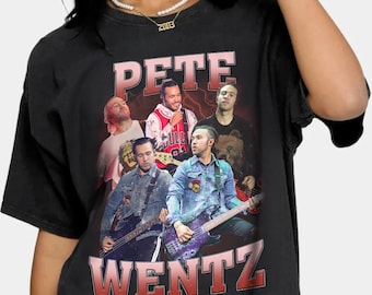 May include: Black t-shirt with a vintage-style graphic of Pete Wentz and the band Fall Out Boy. The graphic features the band members playing instruments and the text "Pete Wentz" in large, red letters.