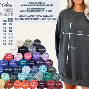 May include: A size chart for a unisex garment-dyed sweatshirt. The chart shows the width, length, and sleeve length in inches for sizes S through 3XL. The sweatshirt is made of 80% ring-spun cotton and 20% polyester.