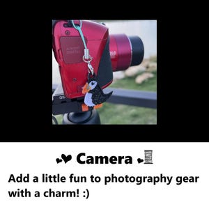 Camera charm. Add a little fun to photography gear with a charm! Handmade cute embroidery camera charm, embroidered cute puffin bird design charm adds a touch of cuteness. Unique charm to decorate fashion accessories #embroidery #embroidered #charm #accessories #charms #puffin #birds #camera #gifts #handmade