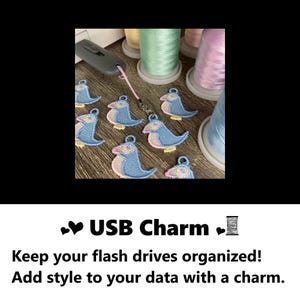 USB charm. Keep your flash drives organized! Add style to your data with a charm. Puffin bird watcher lover charm attached to an embroidery machine USB flash drive next to sewing supplies, thread. #USB #charms #puffin #gifts #handmade