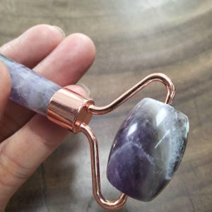 Facial Massage Amethyst Quartz Stone Facial Massage Stone Roller Smooth Texture Natural Amethyst Quartz Stone width 4.45 cm