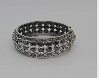 Three-row silver bracelet with multi-colored gems