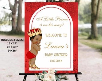 May include: A red and gold baby shower welcome sign with the text "A Little Prince is on his way!" and "Welcome to Laura's Baby Shower." The sign features a cartoon baby wearing a crown and red shorts. Available in 18 x 24, 20 x 30, and 24 x 36 inch sizes.