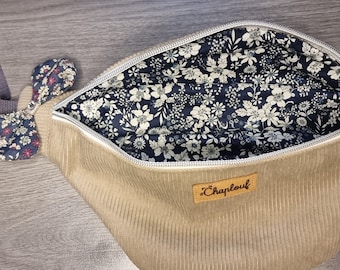 Beige corduroy fanny pack with blue flower interior