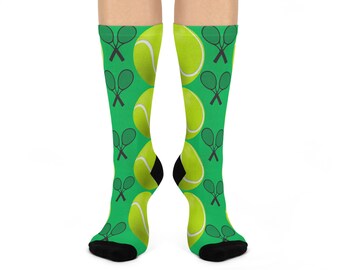 May include: A pair of green socks with a tennis ball and crossed tennis rackets pattern.