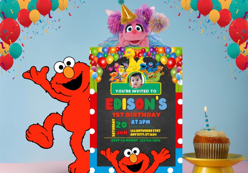 May include: A Sesame Street themed birthday invitation with a photo of a baby boy. The invitation is decorated with colorful balloons, Sesame Street characters, and a chalkboard background. The text on the invitation reads "You're invited to Edison's 1st Birthday, Saturday, January 20 at 3pm, 123 Anywhere Street, Any City, ST 1234, RSVP to Mommy: 123 456 7890".