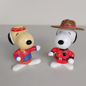 Lot of two vintage Snoopy plastic toy McDonald&#39;s 1999 Snoopy figure with hat in red and white color made in China for McDonald&#39;s Canada