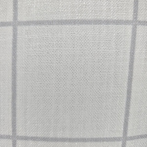May include: A white fabric with a grid pattern. The fabric has a subtle texture and a slightly off-white color.