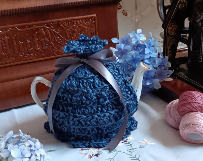 Blue crocheted teapot cosy