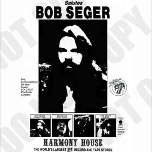 May include: Black and white concert poster for Bob Seger, saluted by Harmony House. The poster features a portrait of Seger and text that reads "SOLD OUT Pine Knob Concerts." Additional images of Seger and album titles are included.