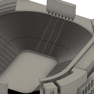 May include: A 3D model of a large stadium with a gray concrete exterior and a large open field in the center. The stadium has multiple levels of seating and a large scoreboard at the top.