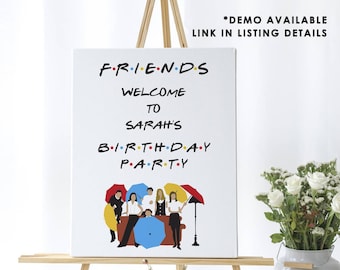May include: A white canvas print with a Friends theme. The print features the iconic Friends logo, the words "Welcome to Sarah's Birthday Party", and a cartoon illustration of the six main characters from the show. The print is displayed on an easel.