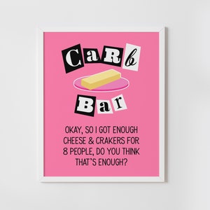 May include: A pink and white framed print with the text "CaR6 Bar" in black block letters. The print features a stick of butter on a pink plate. The text below the image reads "OKAY, SO I GOT ENOUGH CHEESE & CRAKERS FOR 8 PEOPLE, DO YOU THINK THAT'S ENOUGH?"