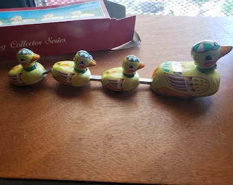 Schylling Duck Family Wind-Up Mama Duck Pulls "Bobbing" Ducklings Around Replica Tin Toy