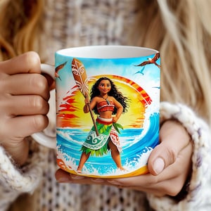 May include: A white ceramic mug with a colorful image of a woman with long brown hair holding a paddle. The image is set against a background of a sunset over the ocean with waves and birds flying.