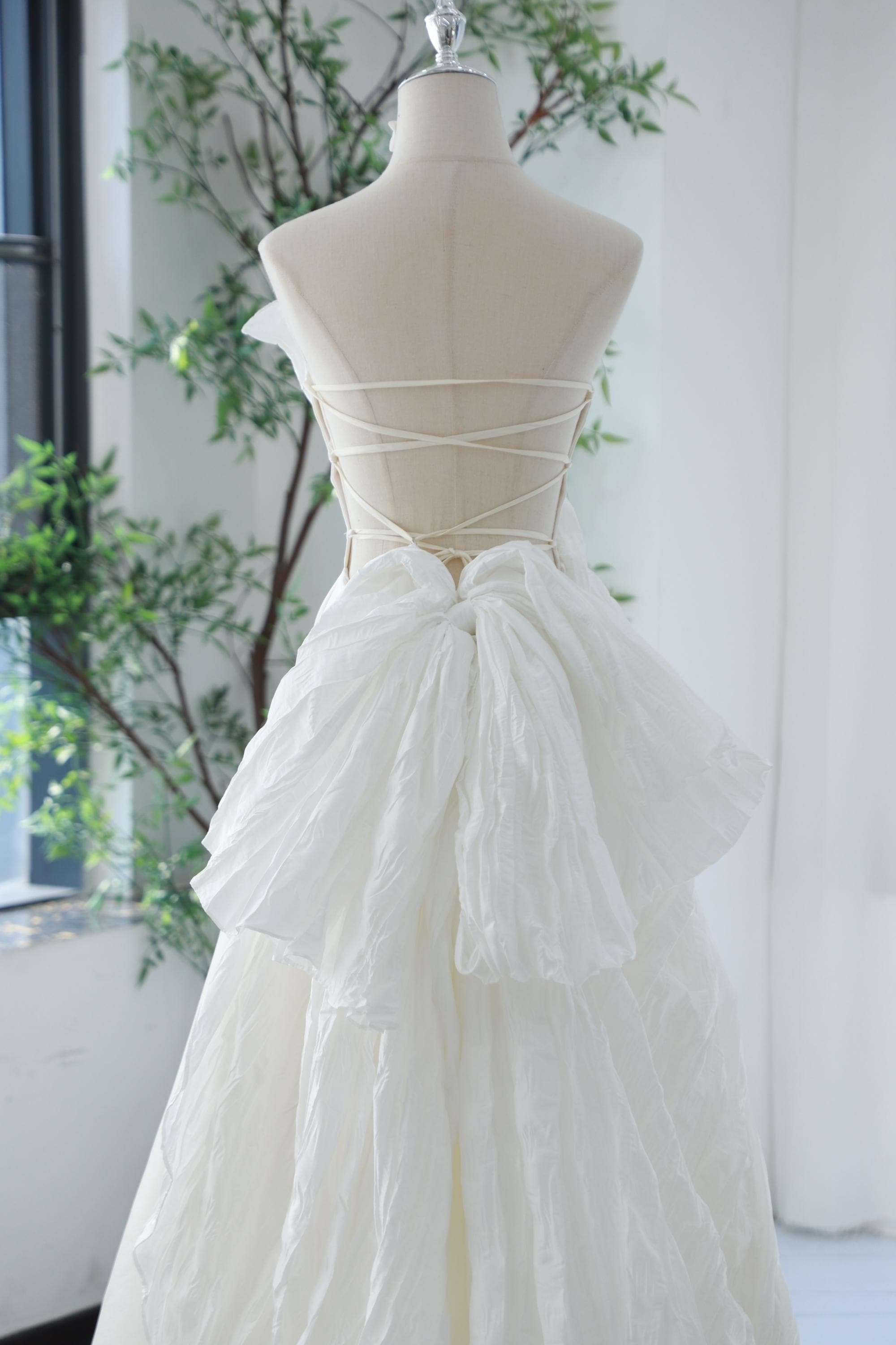 Backless bridal dress modern trendy wedding gown custom open back strapless A-line satin pleated taffeta asymmetric bow tie ivory