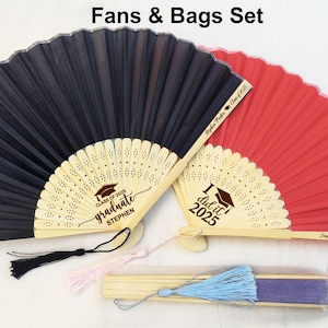 May include: Two graduation fans with personalized messages. One fan is black with the text "Class of 2023 graduate Stephen" and the other is red with the text "I did it 2023".