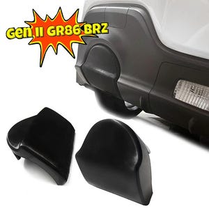 May include: Two black plastic bumper guards for a car. The guards are designed to protect the bumper from scratches and dents. The guards are shown on a white car with the text "Gen III GR86 BRZ" in red and yellow.