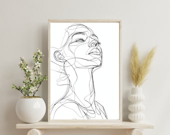 Könnte beinhalten: Ein gerahmter Wandkunstdruck mit einer schwarzen, durchgehenden Linienzeichnung des Gesichts und Halses einer Person, die nach oben blickt. Das Kunstwerk ist in einem hellen Holzrahmen präsentiert und zeigt klare, kräftige schwarze Linien.