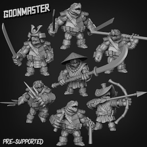 May include: A collection of seven gray, 3D-printed turtle figurines in various warrior poses. Each figure is armored and armed with weapons like swords, spears, and bows. The text "GOONMASTER" and "PRE-SUPPORTED" are visible.