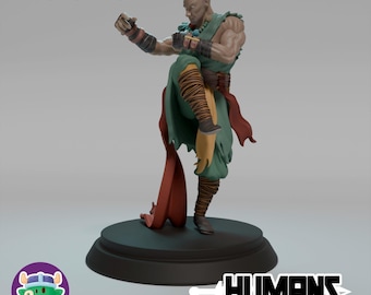 Puede incluir: Figura de un monje calvo en posición de combate, vistiendo ropa verde y beige con detalles rojos. La figura está sobre una base negra, con el texto "Male Monk" en la parte superior y "HUMANS" en la inferior.