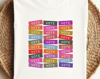 May include: A white t-shirt with the word "VOTE" repeated in colorful rectangular blocks.