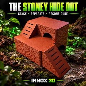 May include: A terracotta-coloured modular pet hideout featuring a stone-textured exterior, two integrated ramps with horizontal slats, and arched openings. The structure displays the text THE STONEY HIDE OUT, STACK, SEPARATE, RECONFIGURE, and INNOX 3D.