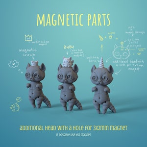 3 grey digital 3D printable ball jointed doll anthro cats in a teal photo studio. First has a magnetic crown, the second a pet and third a unicorn horn on their head. Picture describing magnetic parts.