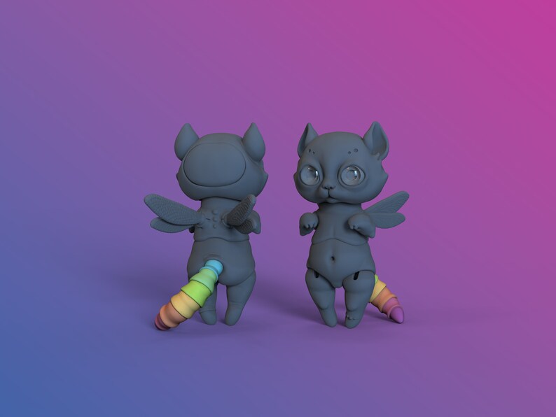 2 digital 3D printable dark gray ball jointed doll cats with rainbow coloured tails in a purple studio standing on hind legs, one is turned backwards to show wings and tail in more detail.