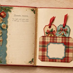 May include: An open journal with a red cover featuring a left page decorated with vintage Christmas ornaments and the text December memories, Tree lights and warm cocoa. A little joy in every corner. The right page has a plaid pocket with two tags.