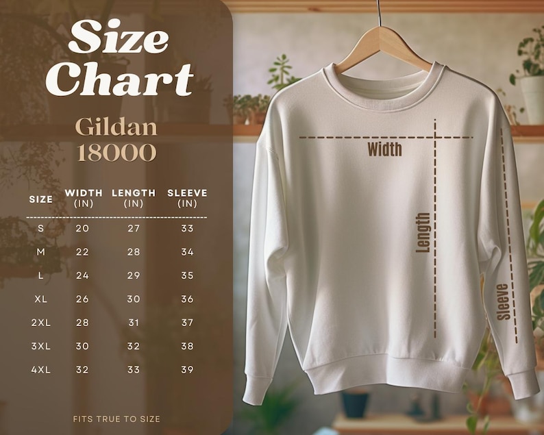 Peut inclure: Un sweat-shirt blanc Gildan 18000 est suspendu &agrave; un cintre en bois. Un tableau des tailles &agrave; gauche affiche les mesures en pouces pour la largeur, la longueur et la manche, des tailles S &agrave; 4XL. Le texte "Size Chart" est en haut.