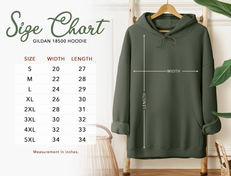 May include: An olive green Gildan 18500 hoodie displayed on a wooden hanger. The image includes a size chart with measurements in inches, showing sizes S to 5XL. The chart details width and length for each size, with the smallest size having a width of 20 inches and a length of 27 inches.