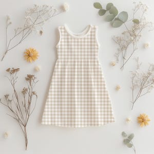 Baby dress mockup using beige gingham seamless pattern – soft neutral printable fabric