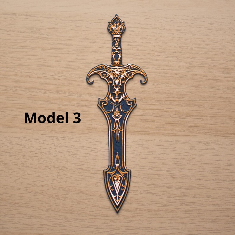 May include: A decorative sword with intricate gold and navy blue detailing. The sword features a detailed hilt and blade design, with the text "Model 3" on the left side. The overall design is ornate and stylized.