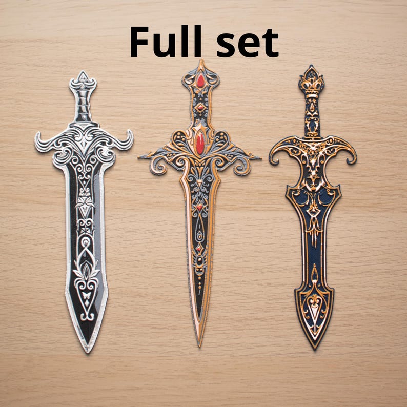 May include: Three decorative swords with ornate designs. The swords feature silver, gold, and black accents, with red gemstones. The text "Full set" is displayed above the swords.