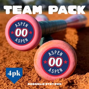 May include: Pink baseball bats with the text "TEAM PACK" at the top. The ends of the bats have a circular design with the word "ASPEN", the number "00", and red stars. The text "4pk" is in a blue diamond shape in the lower left corner.