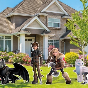 May include: A black dragon and a white dragon with their riders, a boy and a girl, standing in front of a suburban house. The boy is wearing a brown leather jacket and the girl is wearing a brown fur vest and holding an axe.