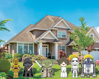May include: A collection of Star Wars character yard decorations, including C-3PO, Darth Vader, Yoda, Princess Leia, a Stormtrooper, and R2-D2, are displayed on a green lawn in front of a house. The characters are in a cartoon style.
