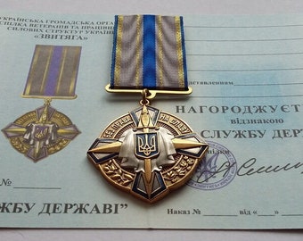 Ukrainische Medaille ""Für Verdienste um den Zustand"" mit Urkunde."