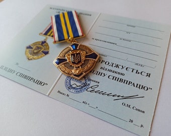 Medaglia del tridente ucraino "PER UNA COOPERAZIONE EFFICACE" con diploma. Gloria all'Ucraina