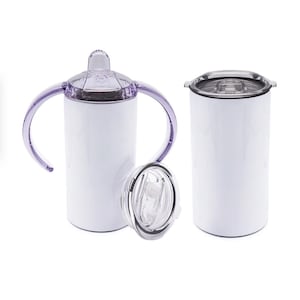 May include: White insulated tumbler with a clear lid and a purple handle. Another white tumbler with a black lid is also shown. A clear lid with a straw is placed in front of the tumblers. The tumblers are designed to keep drinks cold or hot.
