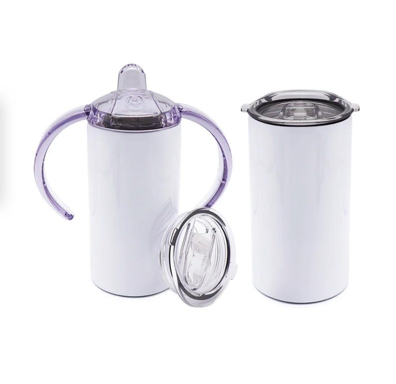 May include: White insulated tumbler with a clear lid and a purple handle. Another white tumbler with a black lid is also shown. A clear lid with a straw is placed in front of the tumblers. The tumblers are designed to keep drinks cold or hot.