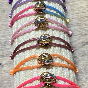 Armband mit 3 Ringen in Gold und Silber