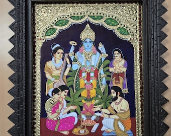 May include: A framed painting depicting a Hindu deity with four arms, surrounded by four figures. The deity is blue and gold, with a crown and jewelry. The figures are dressed in colorful clothing and are engaged in a ritual.
