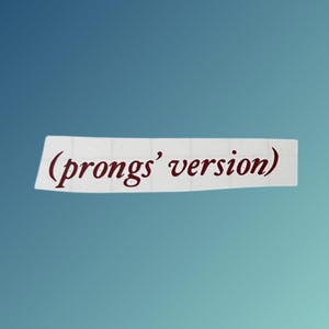May include: A white sticker with the text "(prongs' version)" in a dark red color. The sticker is rectangular and slightly curved, set against a gradient blue background.