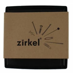 May include: A black tray with a brown cardboard cover featuring the word "zirkel" and illustrations of various hardware items. The illustrations include a nail, screw, pin, and paperclip.