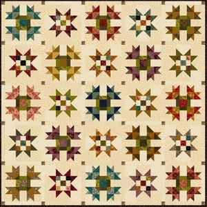 May include: A quilt pattern with 25 different blocks, each featuring a starburst design in various colors, including red, green, blue, brown, and cream. The blocks are arranged in a grid pattern on a cream background.